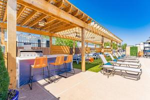 a patio with chairs and tables and a bar at Central 1BR King Bed Suites, Close to Downtown & Domain in Austin