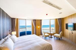 Voodi või voodid majutusasutuse Kenting Long Beach Hotel toas