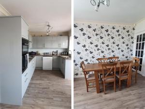 a kitchen and a dining room with a table at Seaspray in Withernsea