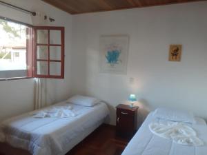 A bed or beds in a room at Casa Bela Vista