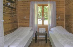 מיטה או מיטות בחדר ב-Amazing home in Lagan with 3 Bedrooms