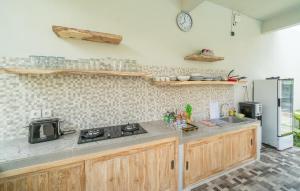 Kuchyň nebo kuchyňský kout v ubytování Amazon Guesthouse by Bukit Vista