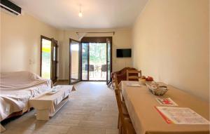 A bed or beds in a room at Nice Apartment In Nafpaktos With Wifi