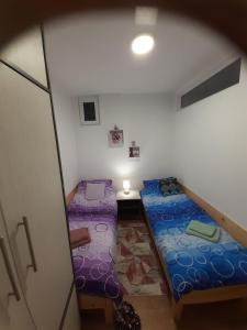 A bed or beds in a room at Apartman Anđela i Aleksa Divčibare