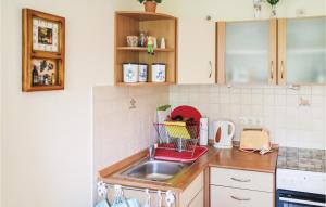 a kitchen with a sink and a counter top at 1 Bedroom Stunning Apartment In Khlungsborn in Kühlungsborn