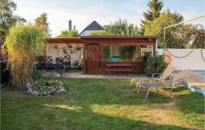 a backyard with a gazebo and a pool at Cozy Apartment In Marlow Ot Gresenhorst With Kitchen in Gresenhorst