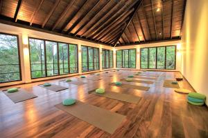 a large room with a lot of yoga mats at Niyagama House in Galle