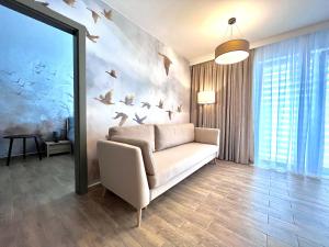Ένα ή περισσότερα κρεβάτια σε δωμάτιο στο Simba&Lea Apartament Ustronie Morskie