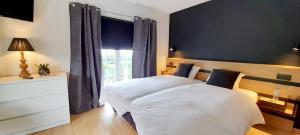 Postel nebo postele na pokoji v ubytování La Ferme du Soyeuru