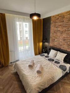 Posteľ alebo postele v izbe v ubytovaní Turzycowa Loft - stylish apartment