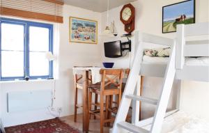 a room with a desk and a bunk bed at Stunning Home In Visby With Sauna in Visby
