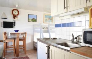 a kitchen with a sink and a counter top at Stunning Home In Visby With Sauna in Visby