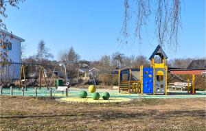 a park with a playground with a slide at Awesome Home In Hassl With Wifi And 1 Bedrooms in Hasslö