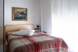 A bed or beds in a room at Hotel La Vela