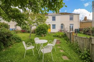 a table and chairs in the yard of a house at Bedford Terrace in Bridport