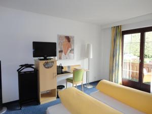 Un pat sau paturi într-o cameră la Hotel Hofbalzers