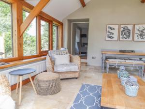 a living room with a chair and a table at Sea View in Newport Pembrokeshire