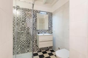 a bathroom with a shower and a toilet and a sink at Civico 22 B&B in Cannole +17 photos