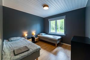 Postel nebo postele na pokoji v ubytování Jõeranna Pond House