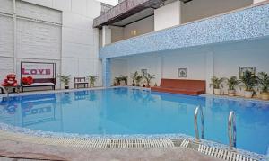 a large swimming pool in a building at Treebo Trend The Marwar Hotel & Gardens in Jodhpur