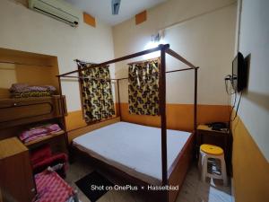 Postel nebo postele na pokoji v ubytování Monalisa Lodge