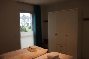 Cama o camas de una habitación en Die Haffhäuser Ferienwohnung VI