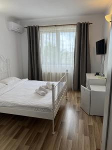 Postel nebo postele na pokoji v ubytování Vila Ann