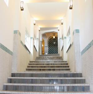 a set of stairs leading up to a building at Yunoshimakan in Gero