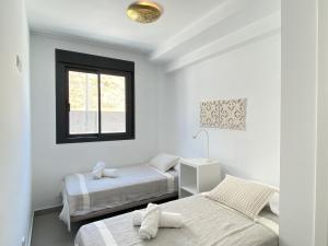 Posteľ alebo postele v izbe v ubytovaní Terrazas de Ladera Duplex 5 Casasol