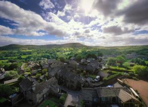 an aerial view of a small town in the hills at Chimney Cottage in Holmfirth