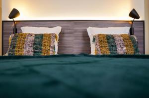 Een bed of bedden in een kamer bij Hotel Gravensteen