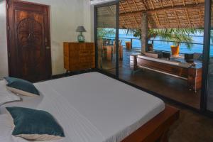 Een bed of bedden in een kamer bij Villa Nautilus