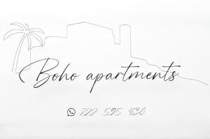 un dessin d'une plage avec un palmier et un calendrier dans l'établissement Boho Apartments, à Peñíscola