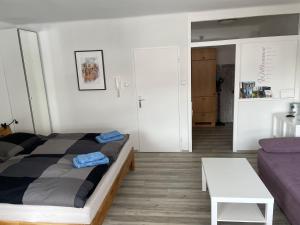 a room with a bed and a couch and a table at Appartement Ferienregion Bad Gastein in Bad Gastein