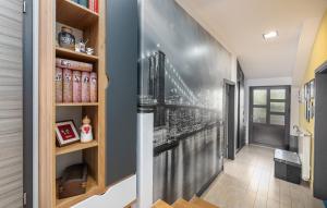 a hallway with a wall mural of a staircase at Apartman David with Balcony in Dračevac +20 photos
