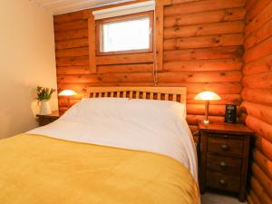 Postel nebo postele na pokoji v ubytování Alwinton Lodge