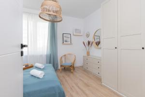 Posteľ alebo postele v izbe v ubytovaní Marina Corner Apartment Gdynia by Noclegi Renters