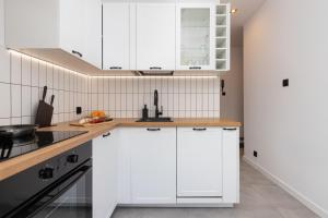Kuchyňa alebo kuchynka v ubytovaní Marina Corner Apartment Gdynia by Noclegi Renters