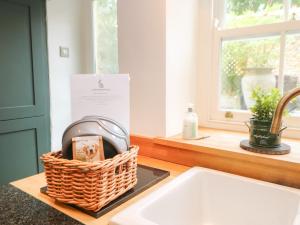 a basket sitting on a counter next to a sink at Hutchinson House in Richmond +29 photos