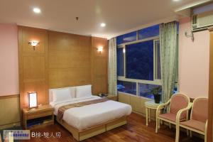 Katil atau katil-katil dalam bilik di Jenq Yang Hotspring Hotel
