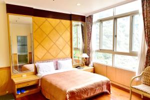 Katil atau katil-katil dalam bilik di Jenq Yang Hotspring Hotel