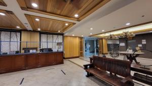 a waiting room with a bench and a waiting area at CedarPeak215 in Baguio