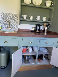 A kitchen or kitchenette at Heywood Glamping