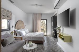TV o dispositivi per l'intrattenimento presso Shtarkman Erna Boutique Hotel Nahariya