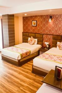 Postel nebo postele na pokoji v ubytování Zambala Retreat & Spa Darjeeling