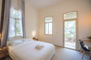Gulta vai gultas numurā naktsmītnē PORT CITY HAIFA - SEA FRONT Luxury Apartments