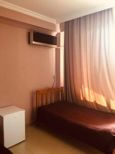 Letto o letti in una camera di Hotel Lotus