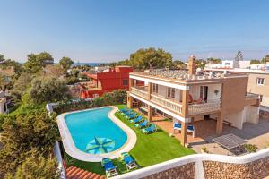 an aerial view of a house with a swimming pool at Villa Maria Isabel in Cala Blanca
