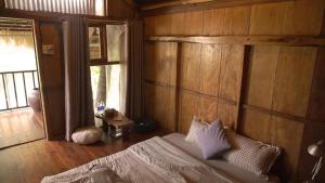 Ein Bett oder Betten in einem Zimmer der Unterkunft Cat Homestay