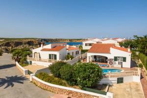 an aerial view of a house with a swimming pool at Villa Saona by Villa Plus in Es Mercadal